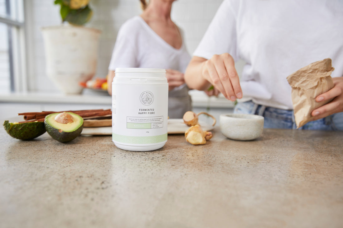 Fiber supplement jar next to avocados in the kitchen