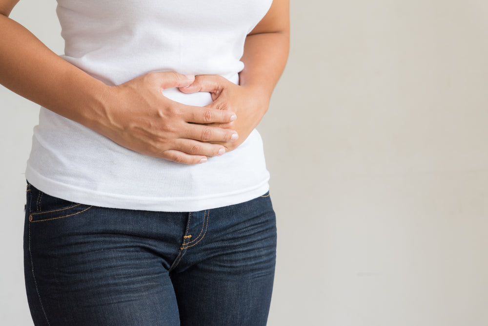 woman holding her stomach