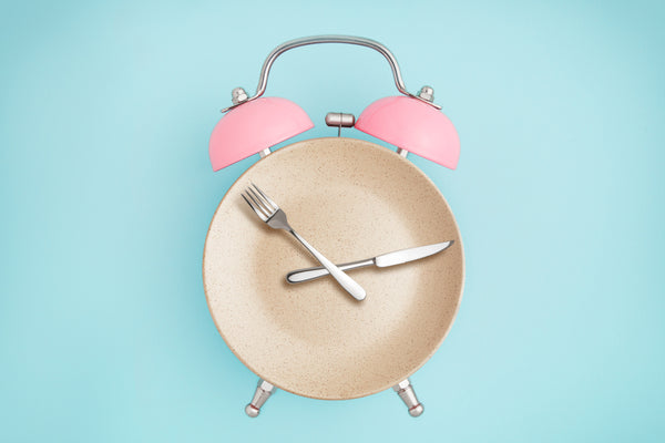 clock with fork and knife as hands