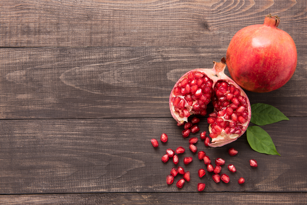 pomegranate on wood background