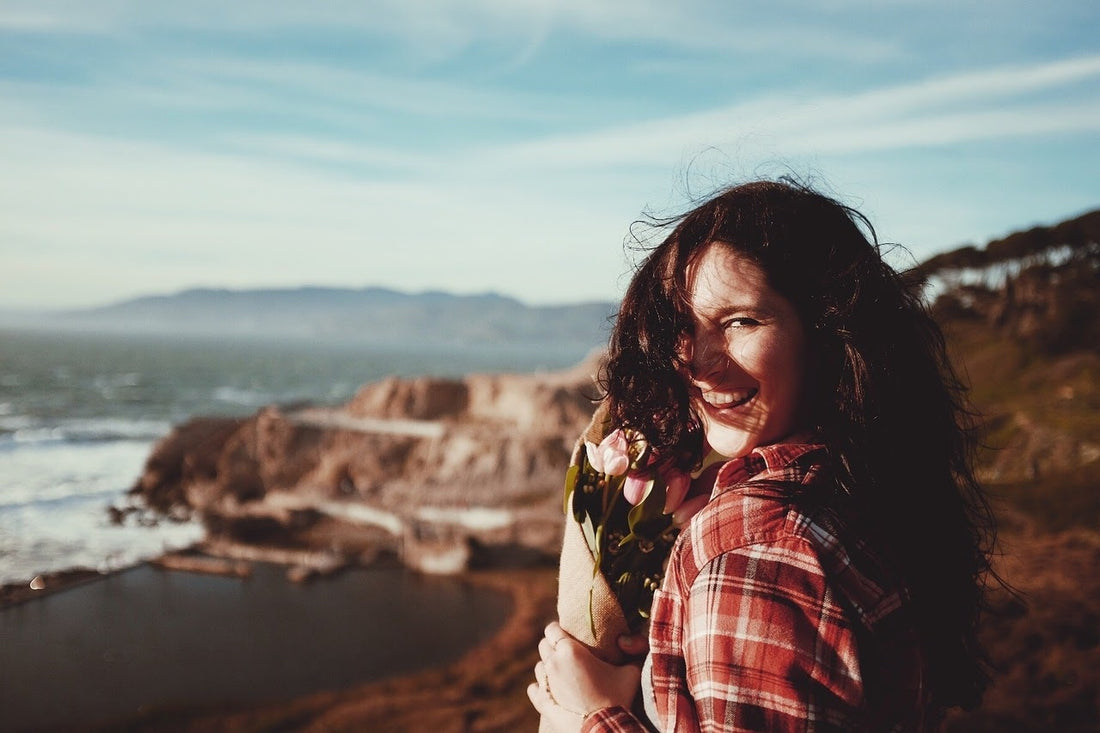 A smiling woman at the beach